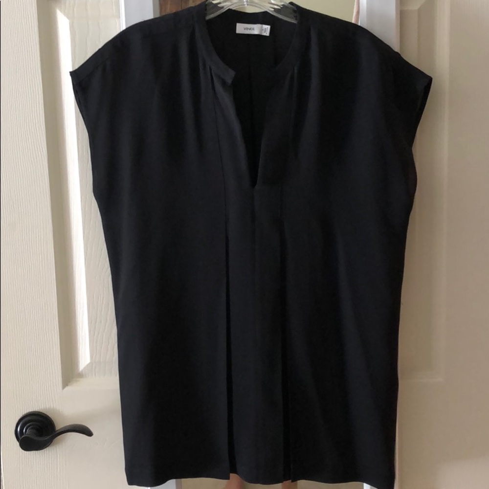 Vince black sleeveless top with pleat details.